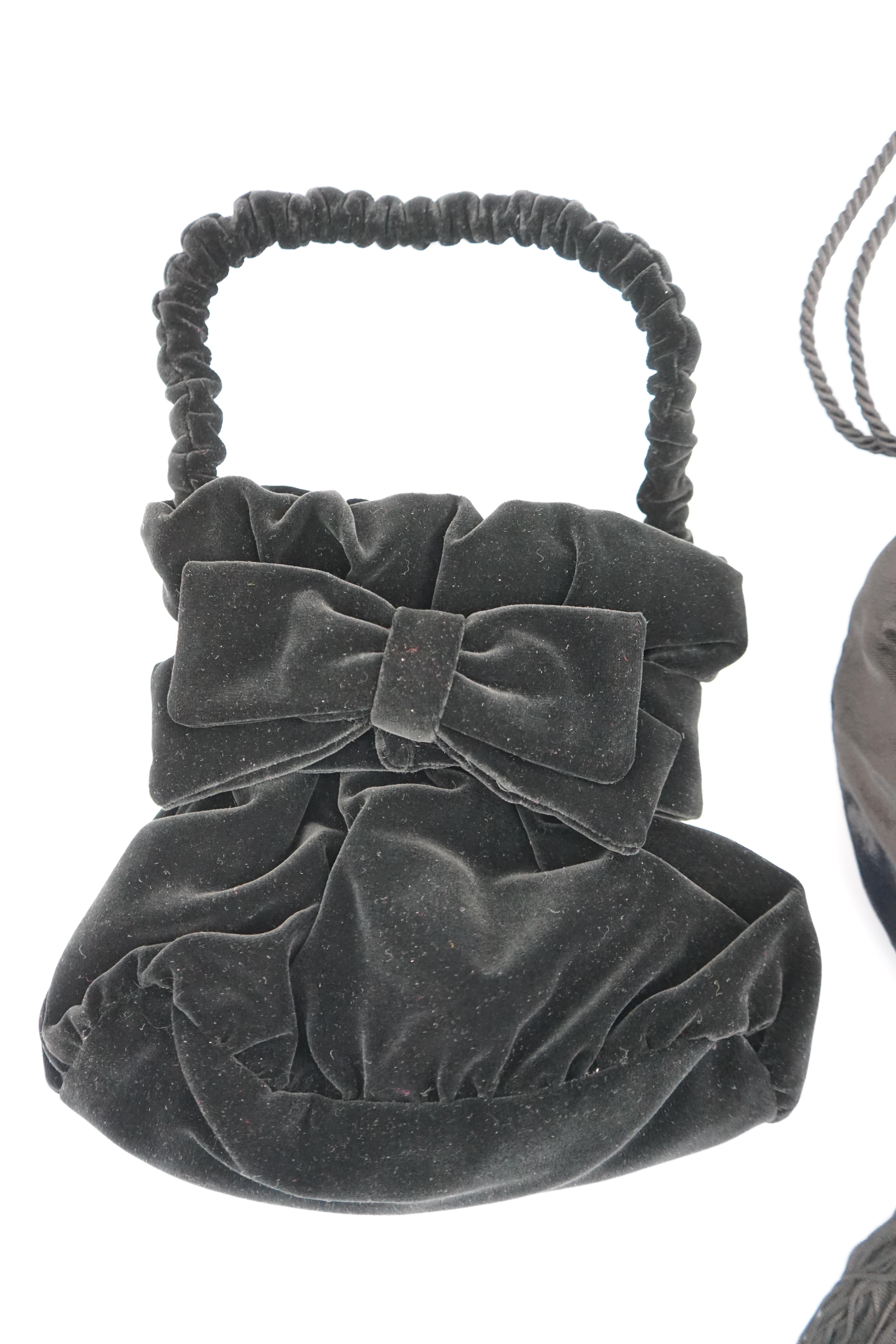 Two black velvet Italian evening bags, one labelled Rita Palmucci and the other Niro. One black silk velvet drawstring with blue satin lining, with tassel and diamanté decoration, the other black velvet with black satin